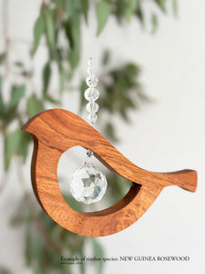 New Guinea rosewood bird tail up suncatcher – rare timber crystal wall art by RT Studios Canberra
