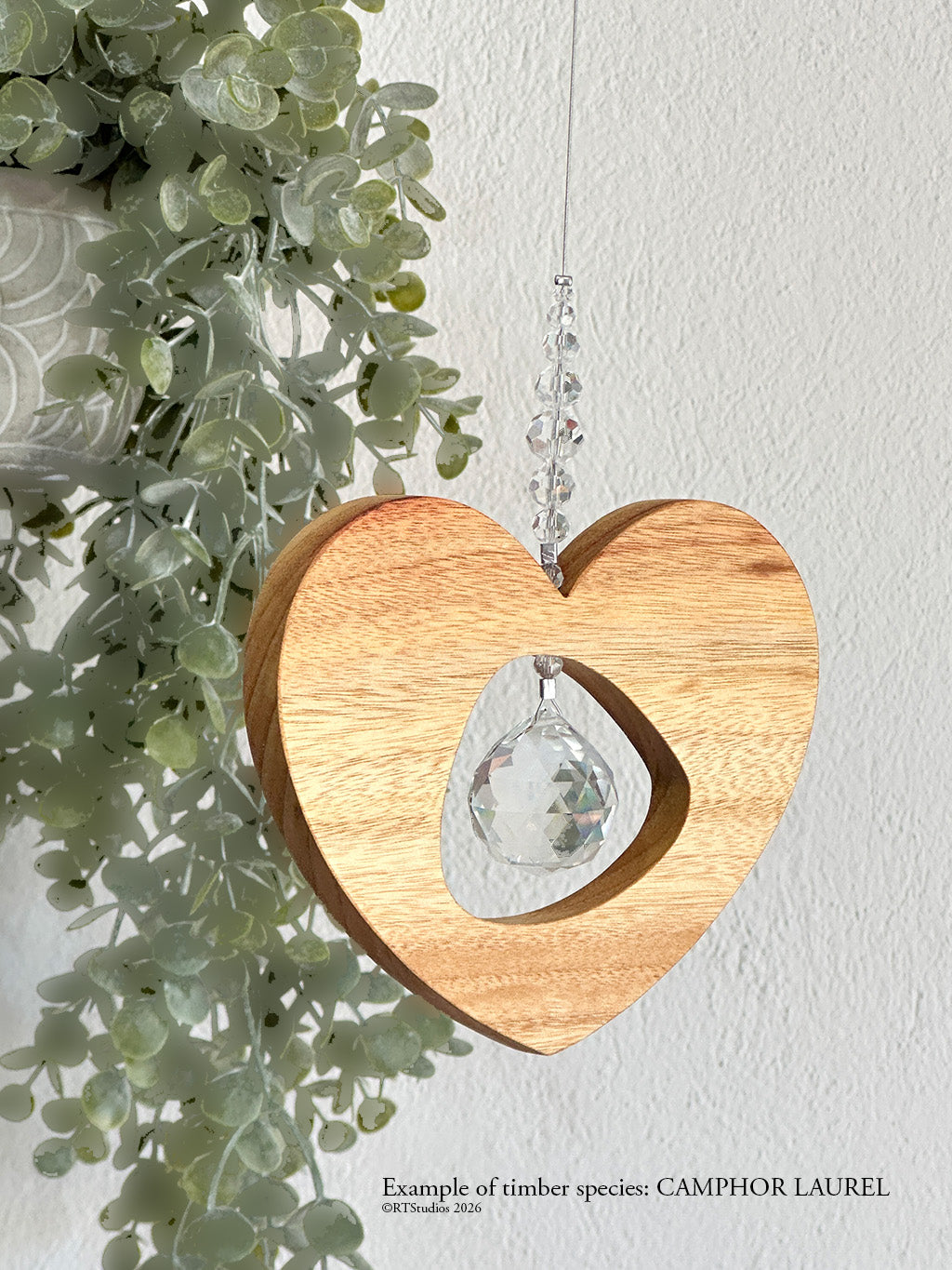 Camphor laurel tri heart suncatcher – one-of-a-kind handcrafted wood and crystal art by RT Studios Canberra