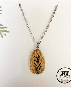 Wooden Silky Oak pendant almond shape with botanical illustration on white background
